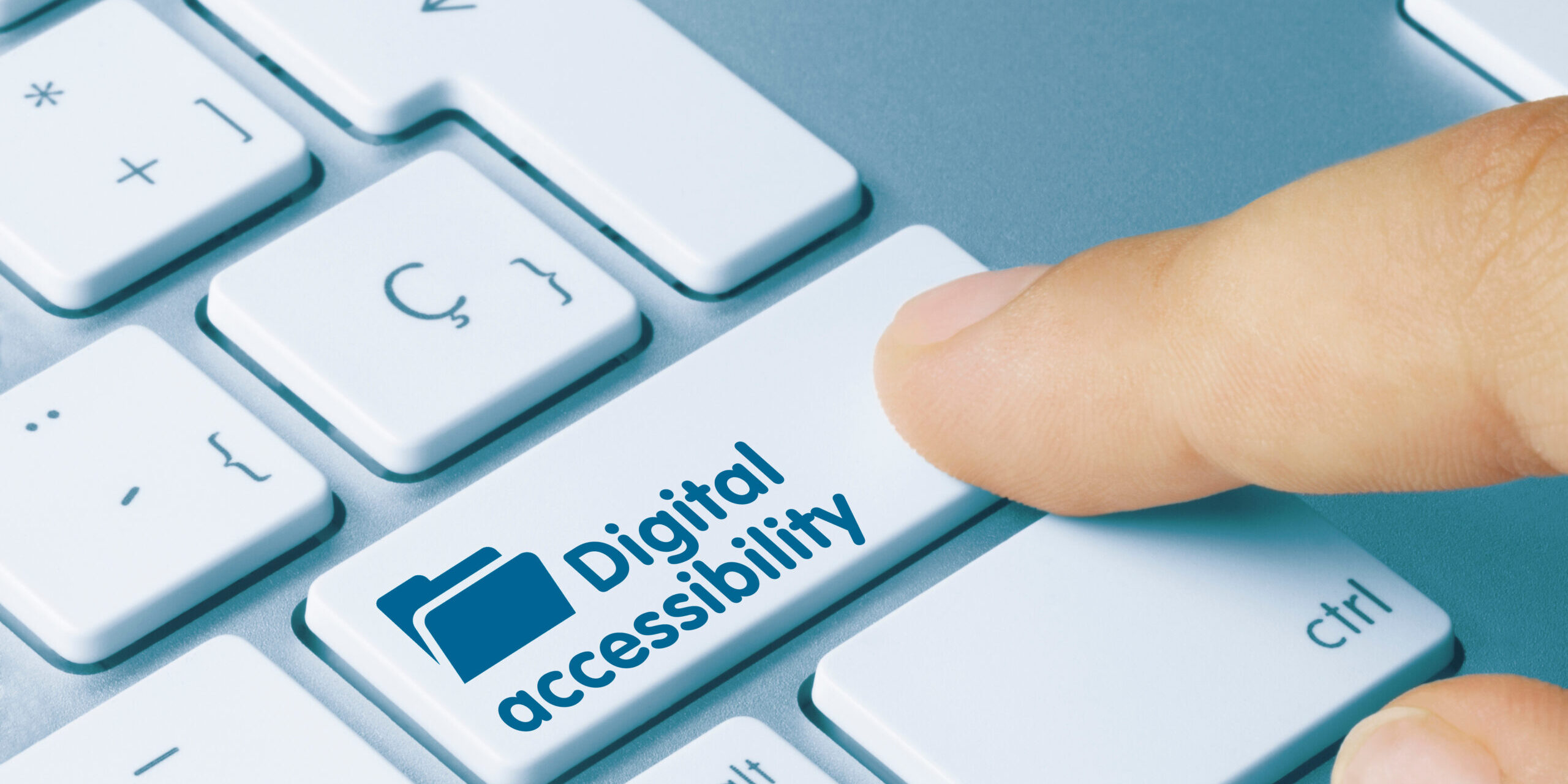 Page header image. Keyboard with finger pressing Digital Accessibility button